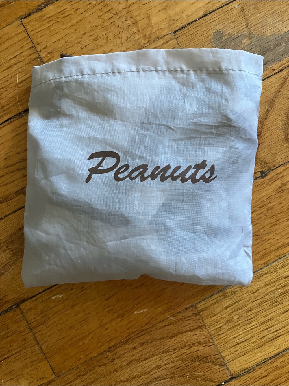 Peanuts Compact Fold-Up Tote in Light Gray with Brown Script